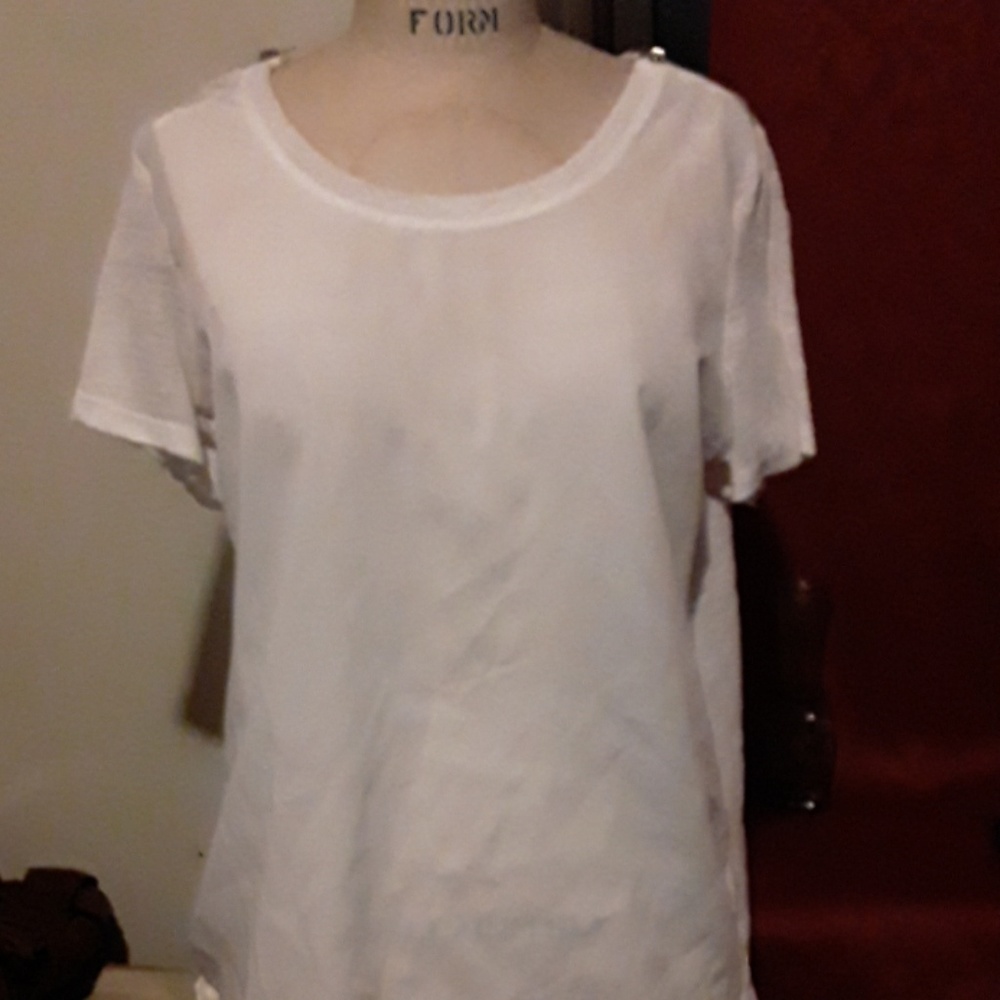 A white dressy tee with a zippers on shoulders